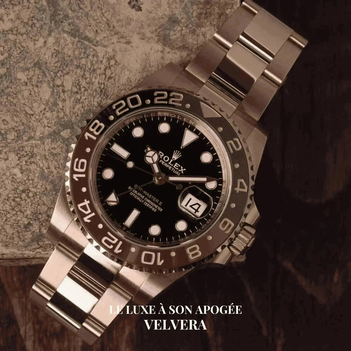 Rolex GMT-Master II Root Beer 126711 luxury watch with black dial on stone background