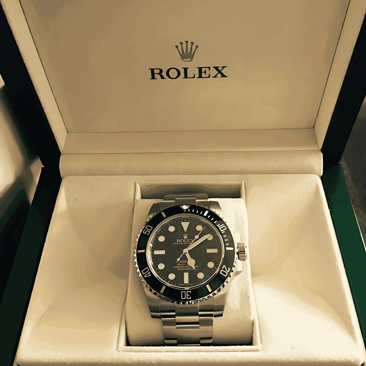 Rolex Submariner black dial men's watch in stainless steel displayed in original box
