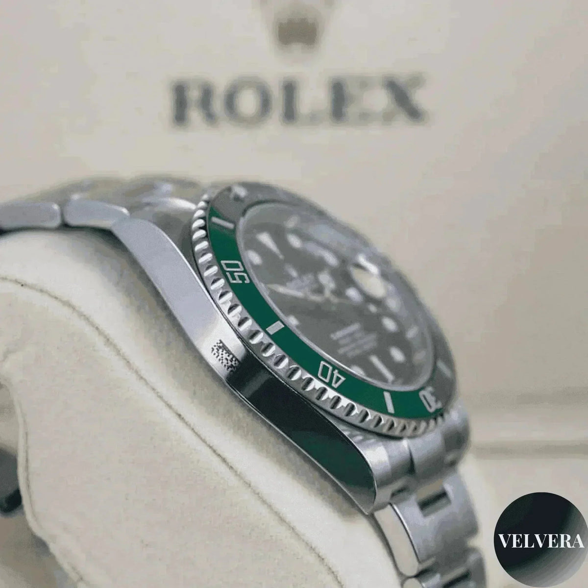 Rolex Submariner green Hulk 116610LV men's watch on cushion with Velvera branding