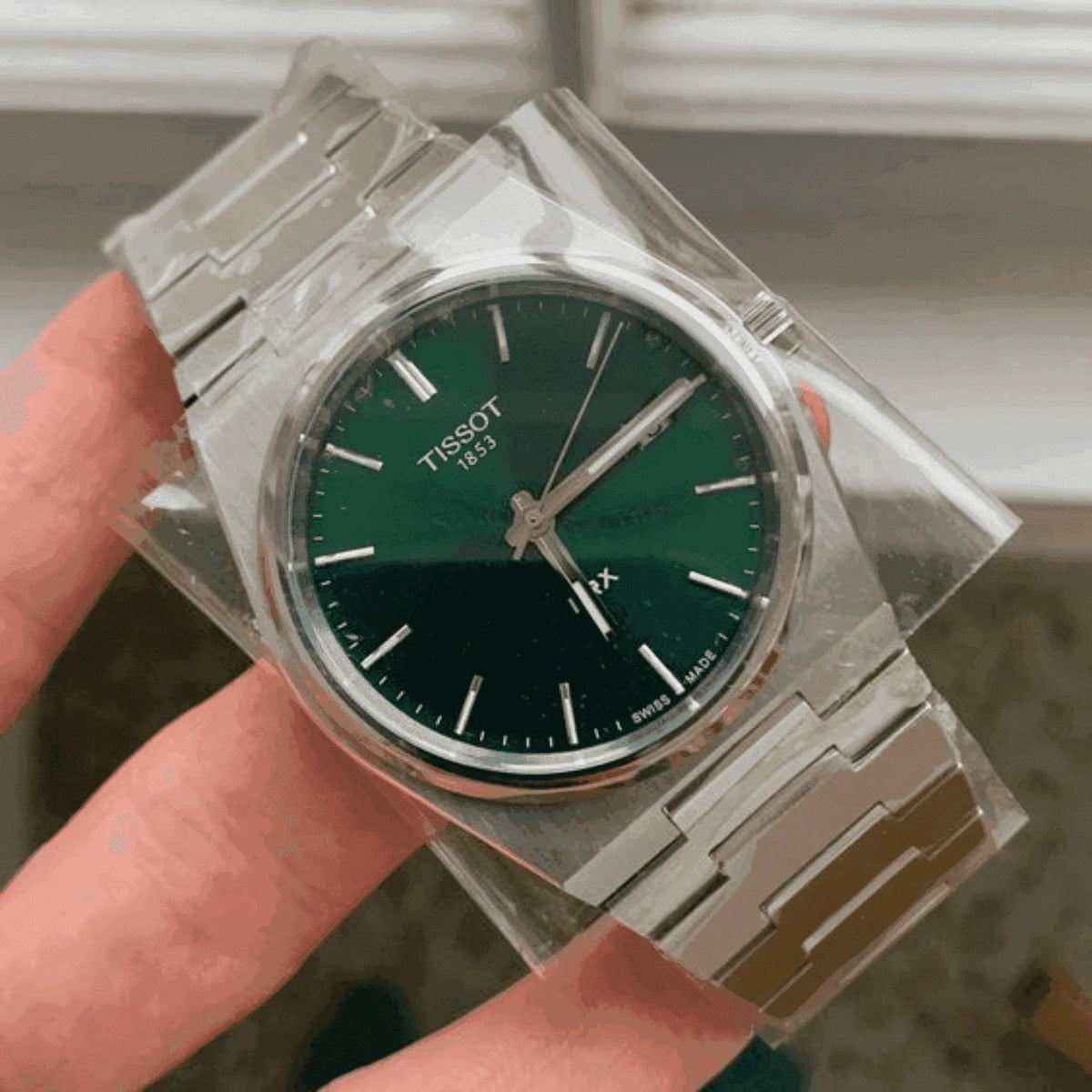 Tissot men's Powermatic 80 watch with green dial and stainless steel bracelet
